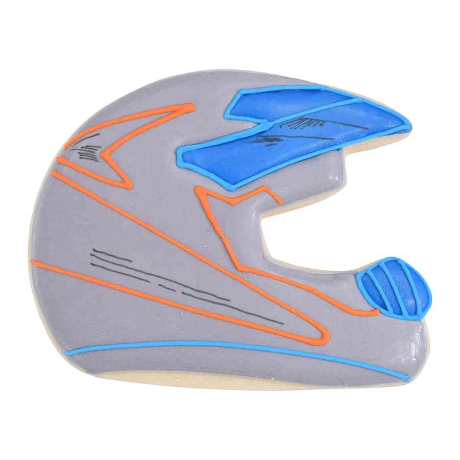 Decorated racing helmet cookie with gray, blue, and orange icing details, resembling a sports helmet.
