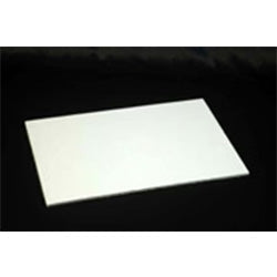 White rectangular cake board photographed at a slight angle on a black background, showing a smooth flat surface and sharp corners for sheet cake presentation.