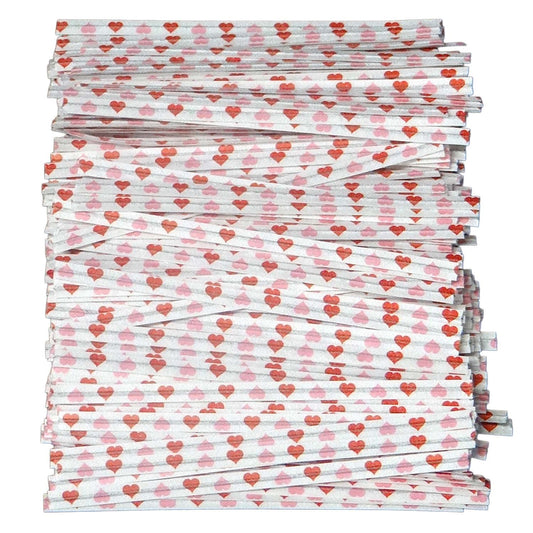 Stack of paper twist ties with red and pink heart pattern, ideal for Valentine’s Day, weddings, or love-themed gift packaging.