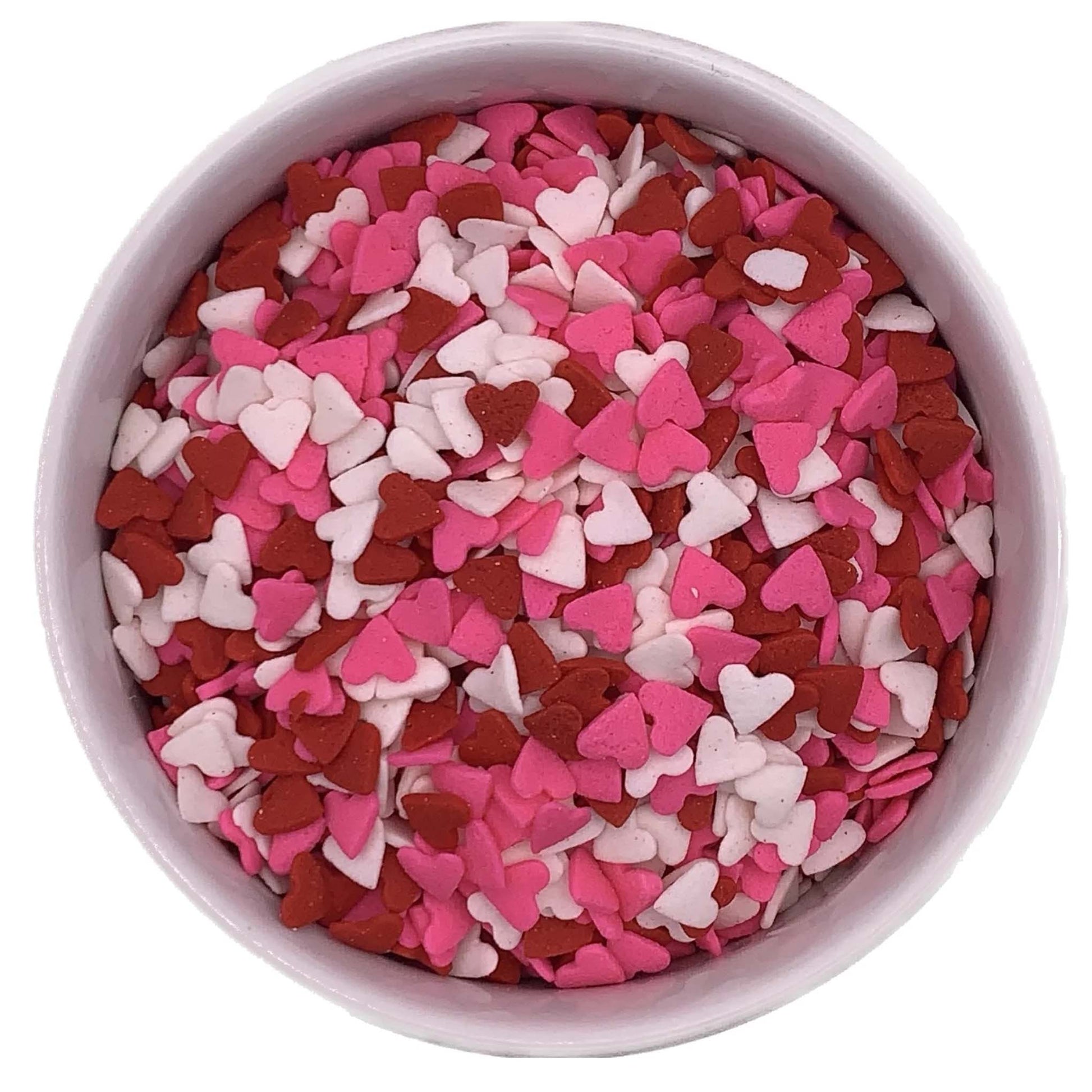Bowl of red, white, and pink heart sprinkles, perfect for decorating Valentine's Day desserts and festive baked goods.