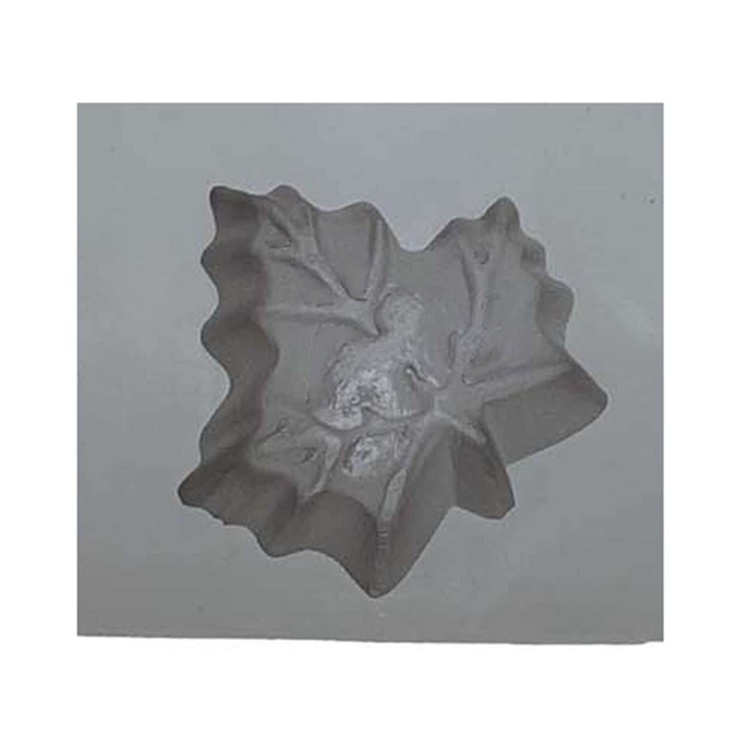 Close-up of small maple leaf rubber mint mold showing shallow depth and detailed leaf veins for fall-themed confections
