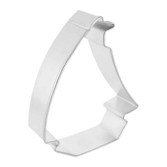 Angled side view of the sailboat cookie cutter, showcasing its sturdy metal construction and defined sail shape.