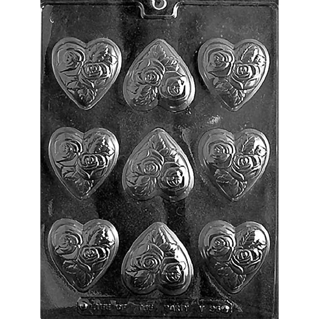 Chocolate mold with nine shallow heart-shaped cavities embossed with roses and leaves, designed for medium-sized romantic chocolates.