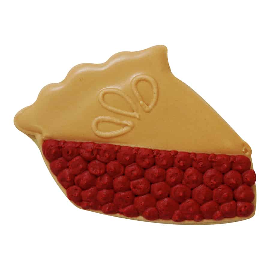 Decorated slice of pie cookie with tan icing for the crust and red icing for the filling.