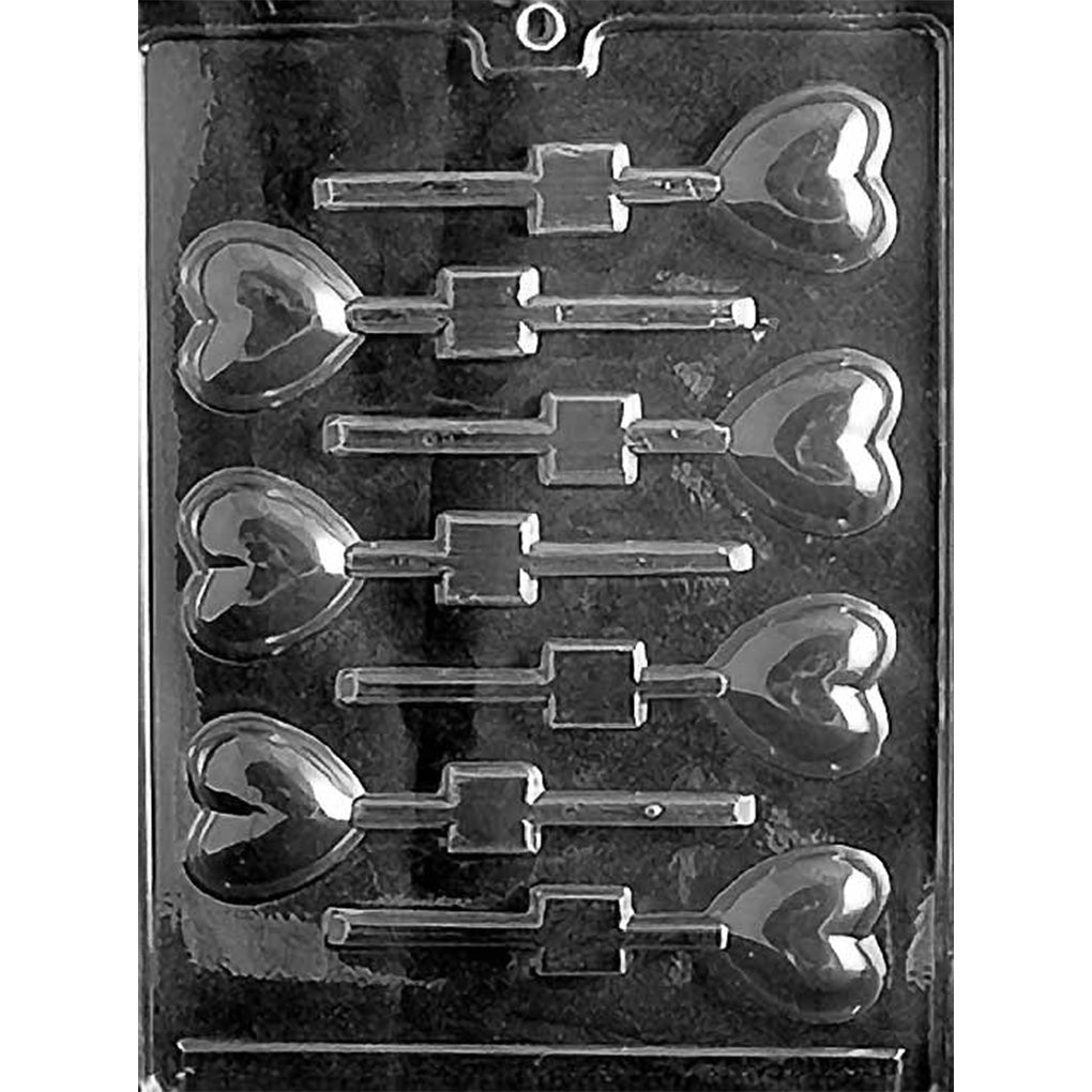 Clear chocolate lollipop mold with seven small heart-shaped cavities, each featuring a smaller heart shape in the center and a straight stick channel.