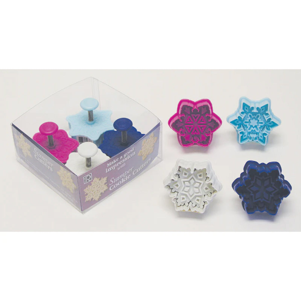 Set of four snowflake cookie cutter plungers in various colors and designs, each with built-in stamp detail, ideal for holiday baking and decorating.