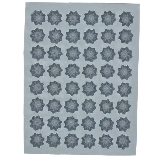 Full sheet of the Snowflake Rubber Cream Cheese Mint Mold showing 56 snowflake-shaped cavities, perfect for crafting winter-themed candies and confections.