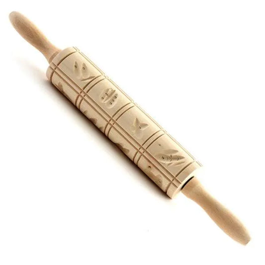 Wooden Springerle rolling pin with carved square cookie designs and handles, shown on white background.