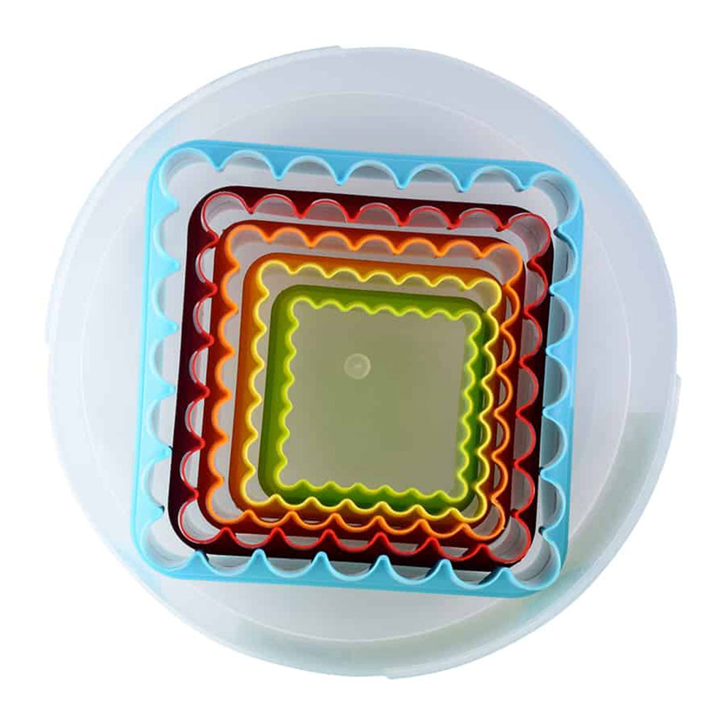 Angled top view of stacked square cookie cutters inside a clear round container, highlighting the double-sided flat and fluted cutting edges.