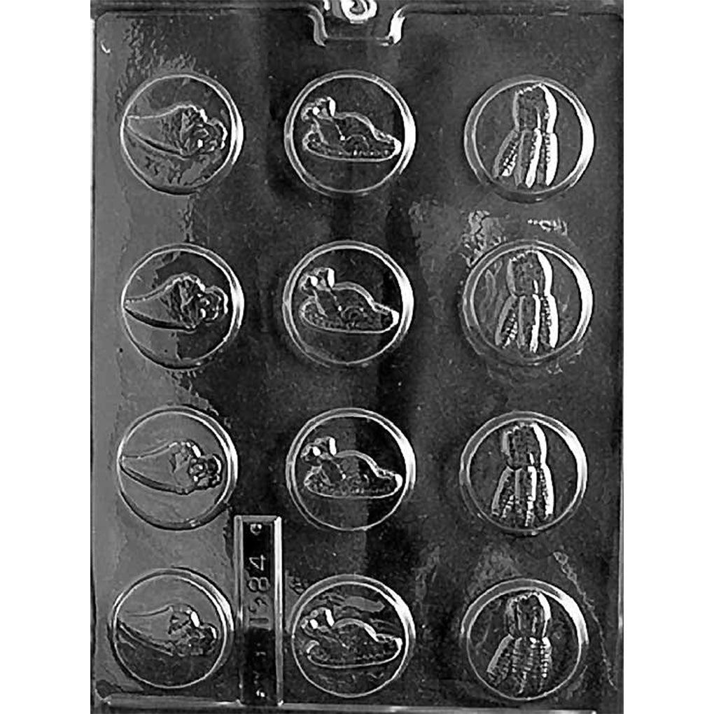 Thanksgiving chocolate mint mold with round cavities featuring embossed cornucopia, roast turkey, and corn in husks designs.