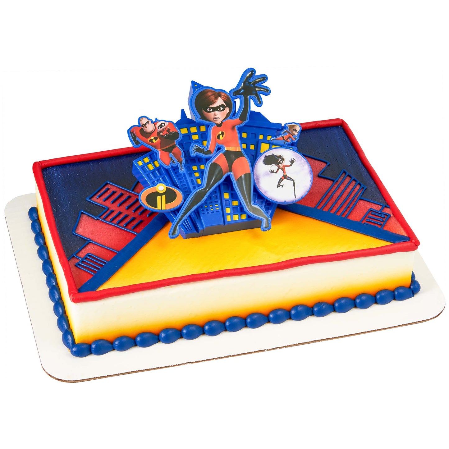 Rectangular sheet cake with a red border and blue graphic design topped with a 3D superhero-themed cake topper featuring a blue city skyline backdrop and character cutouts.
