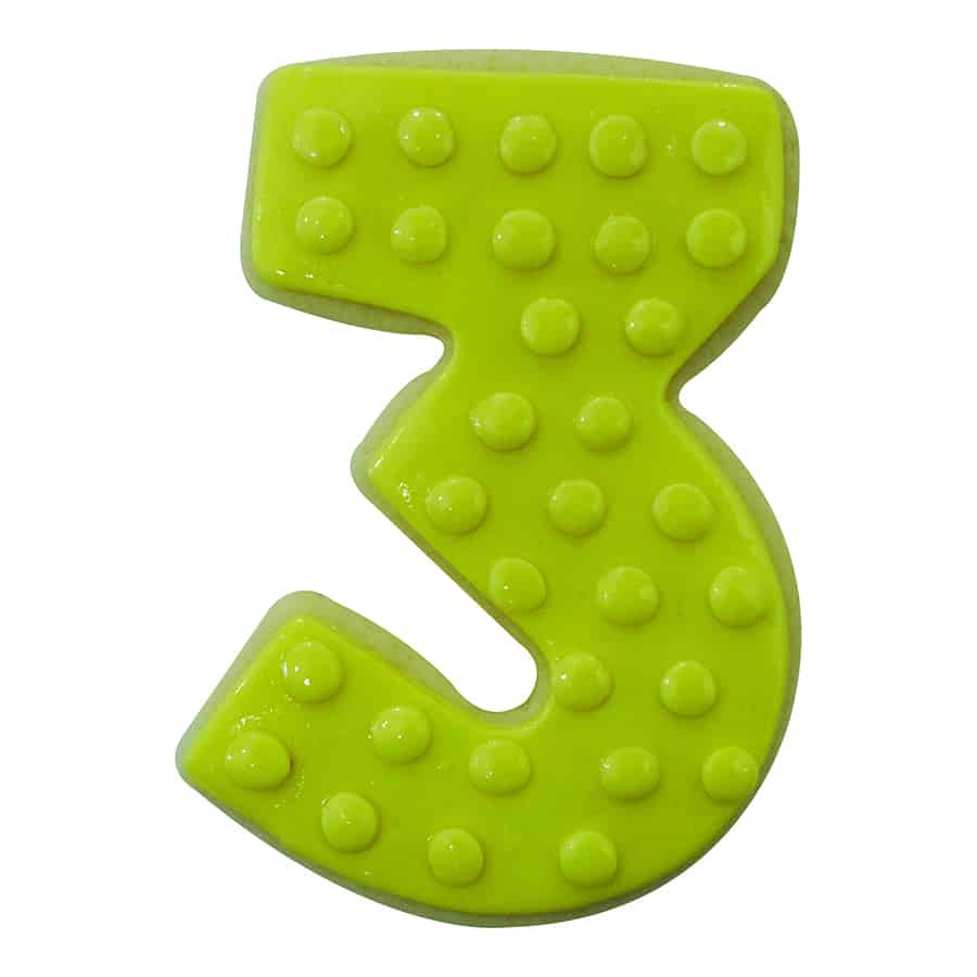 Bright green number 3 cookie with raised polka dot icing details.