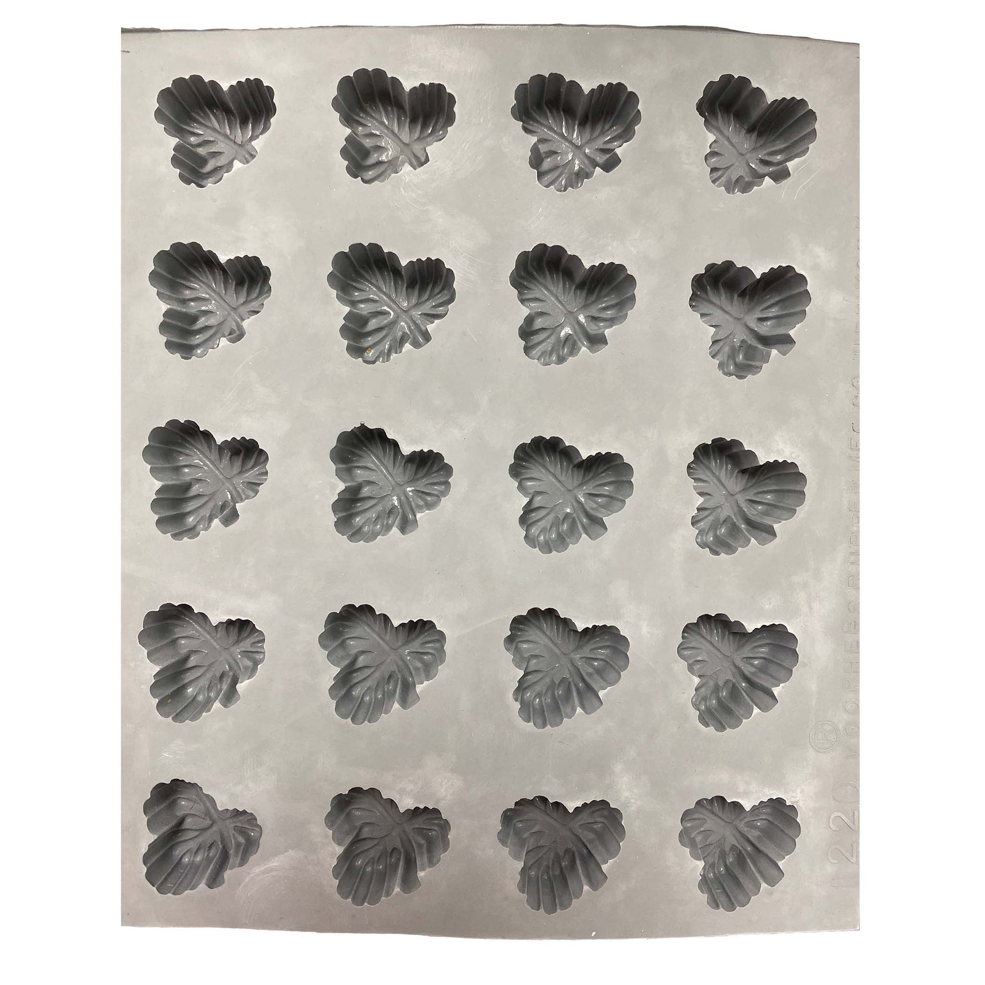 Full sheet of three-leaf rubber mint mold showing multiple cavities arranged in rows for batch production