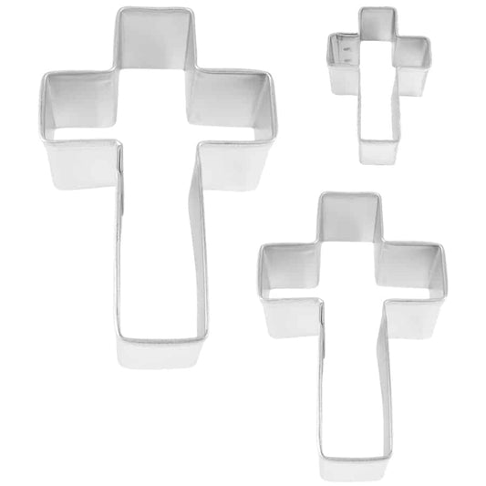Three silver cross cookie cutters in varying sizes displayed against a white background.