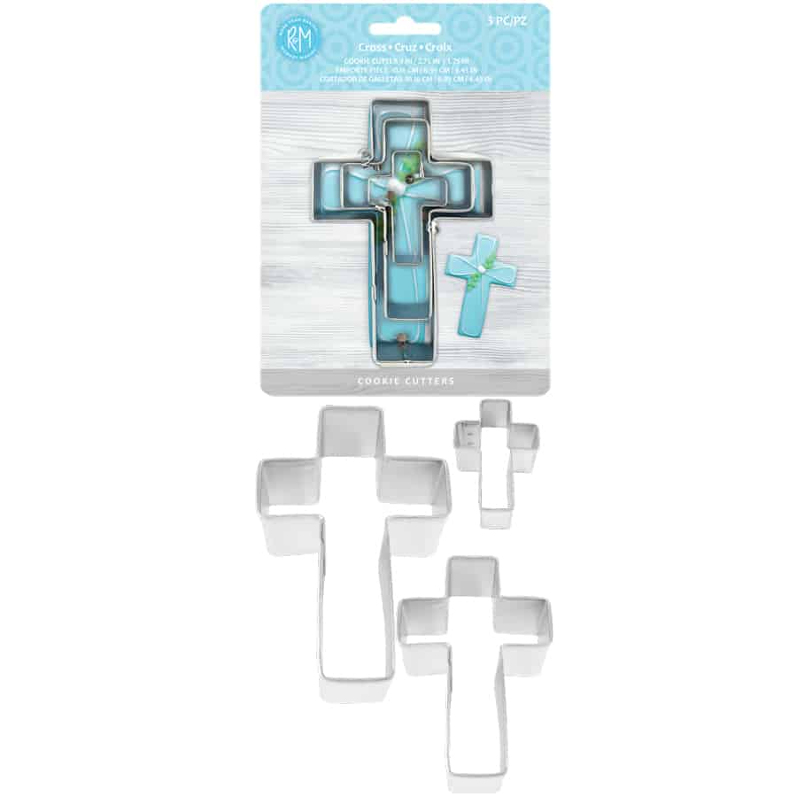 Full view of the cross cookie cutter set, showing retail packaging and the three metal cutters arranged outside the package.