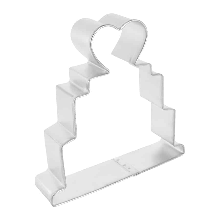 Side-angle view of a metal wedding cake cookie cutter showing its tiered shape and heart detail.