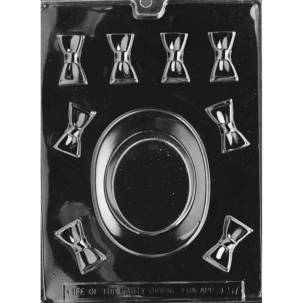 Clear plastic chocolate mold featuring one large oval top hat cavity in the center and several small bow tie cavities around it, shown on a dark background.