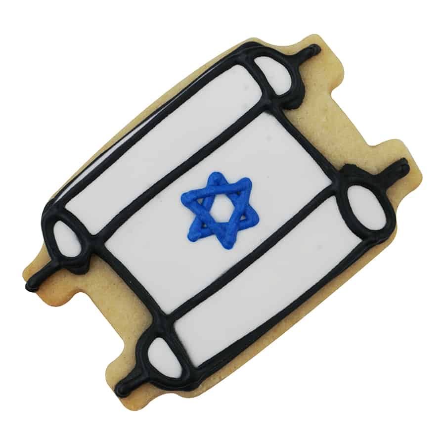 Decorated sugar cookie in the shape of a Torah scroll, featuring white icing, black outline details, and a blue Star of David in the center.