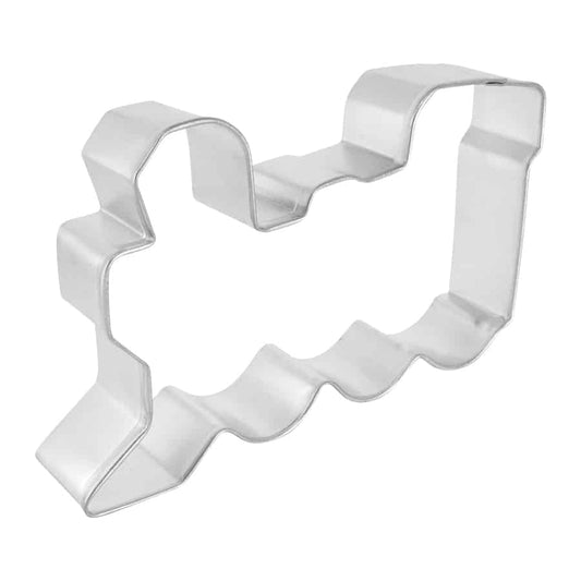 A side-angle view of the train-shaped cookie cutter, highlighting its detailed outline and sturdy construction.