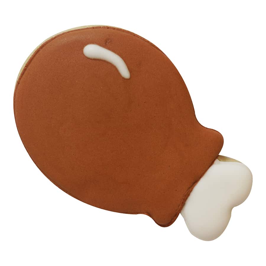 Decorated turkey leg cookie with brown icing and a white bone detail, ideal for Thanksgiving treats