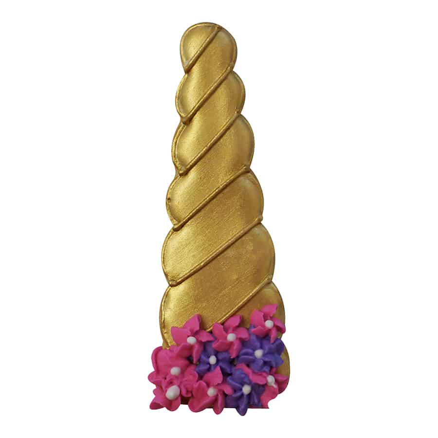 Gold-decorated unicorn horn-shaped cookie with pink and purple floral accents at the base.