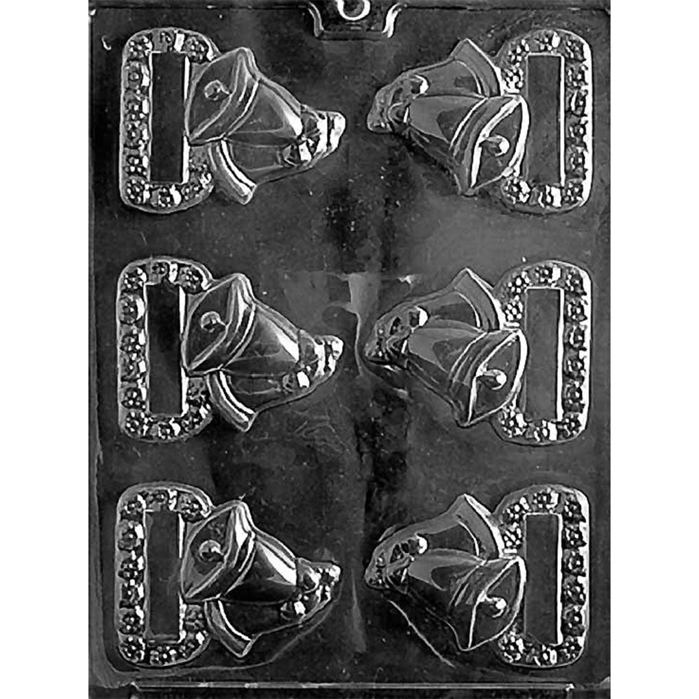 Clear plastic chocolate mold with six cavities, each featuring a rectangular blank plaque bordered by a beaded frame and a raised pair of wedding bells with a ribbon; shown on a dark background.