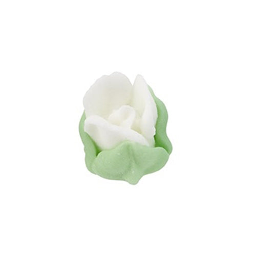 Mini white royal icing rosebud with green leaves, delicate sugar flower decoration.