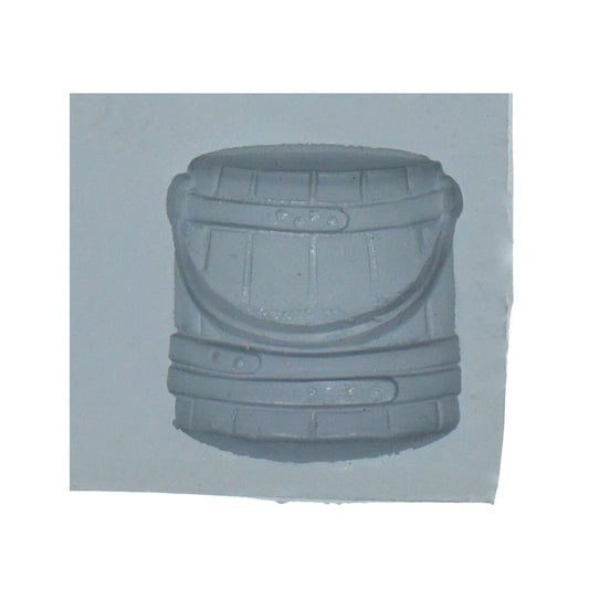 Close-up of wooden bucket rubber mint mold cavity with handle and slatted wood detail for rustic-themed candy making