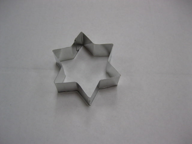 Metal 6-point star cookie cutter measuring 3 inches, displayed on a white background, ideal for baking or holiday-themed cookies.