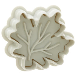 Leaf-shaped plunger cookie cutter by Ateco, used to cut and emboss leaf details on fondant or dough.