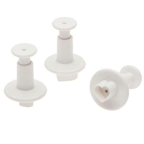 Three white plastic heart plunger cutters in assorted sizes with visible heart-shaped cutting edges