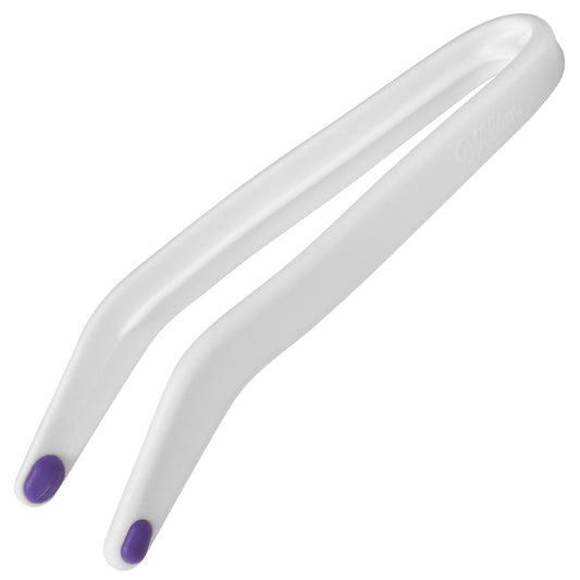 Close-up of candy melt dipping tongs with angled white arms and purple micro-pad tips, designed for handling chocolate-dipped treats