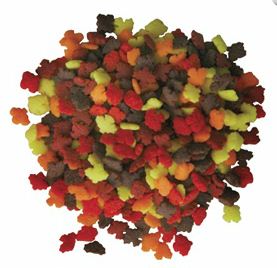 Close-up of mini autumn leaf quins sprinkles in red, orange, yellow, and brown, packaged in a 4 oz container.
