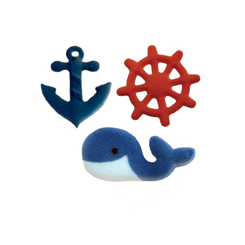 Nautical sugar decoration set featuring a navy blue anchor, red ship's wheel, and blue whale made from molded pressed sugar.