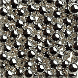 Close-up of 7mm silver dragees with shiny metallic finish, decorative balls used for cake and dessert decoration, non-edible