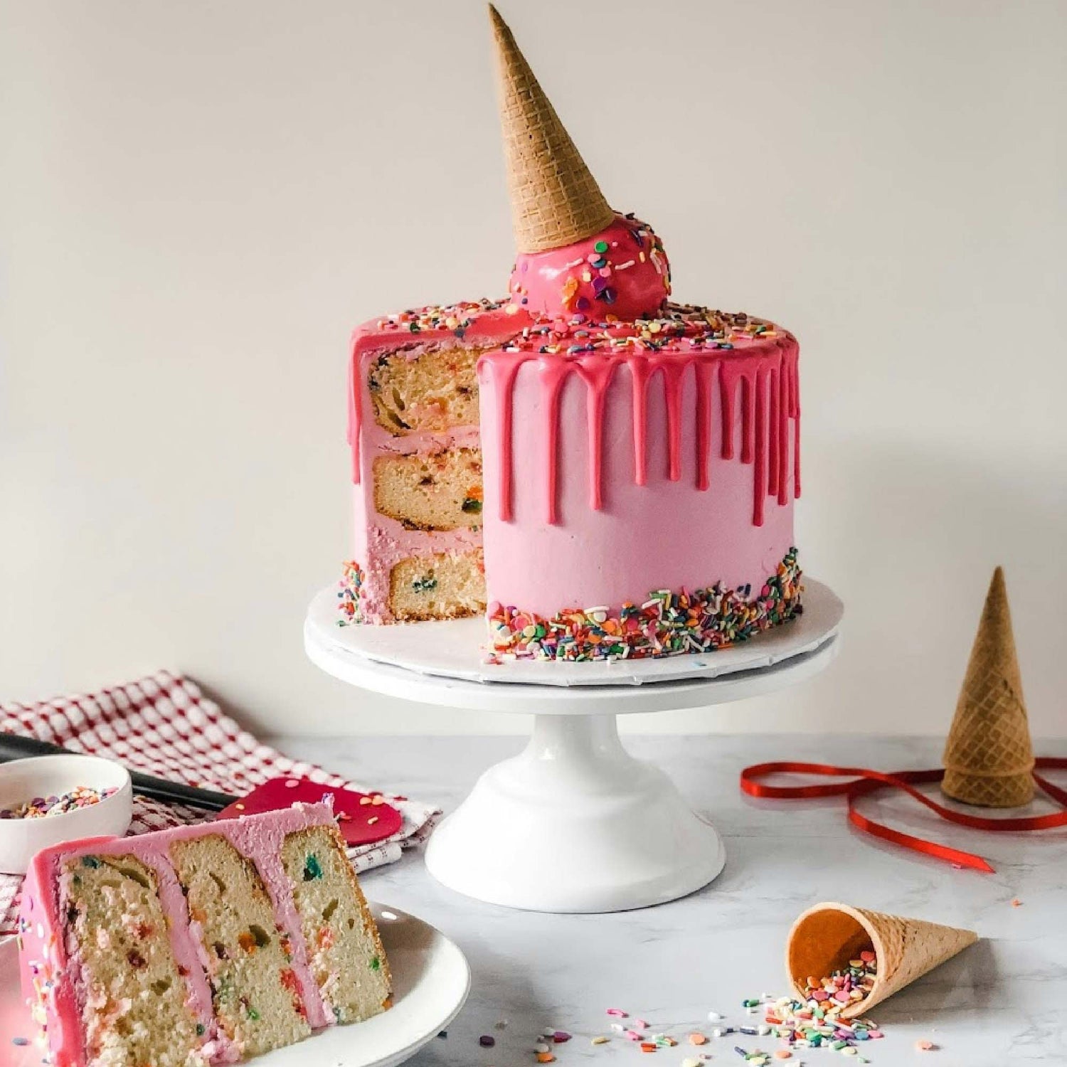 Pink Cake Decorated with a Cake Topper in the form of an ice cream cone.