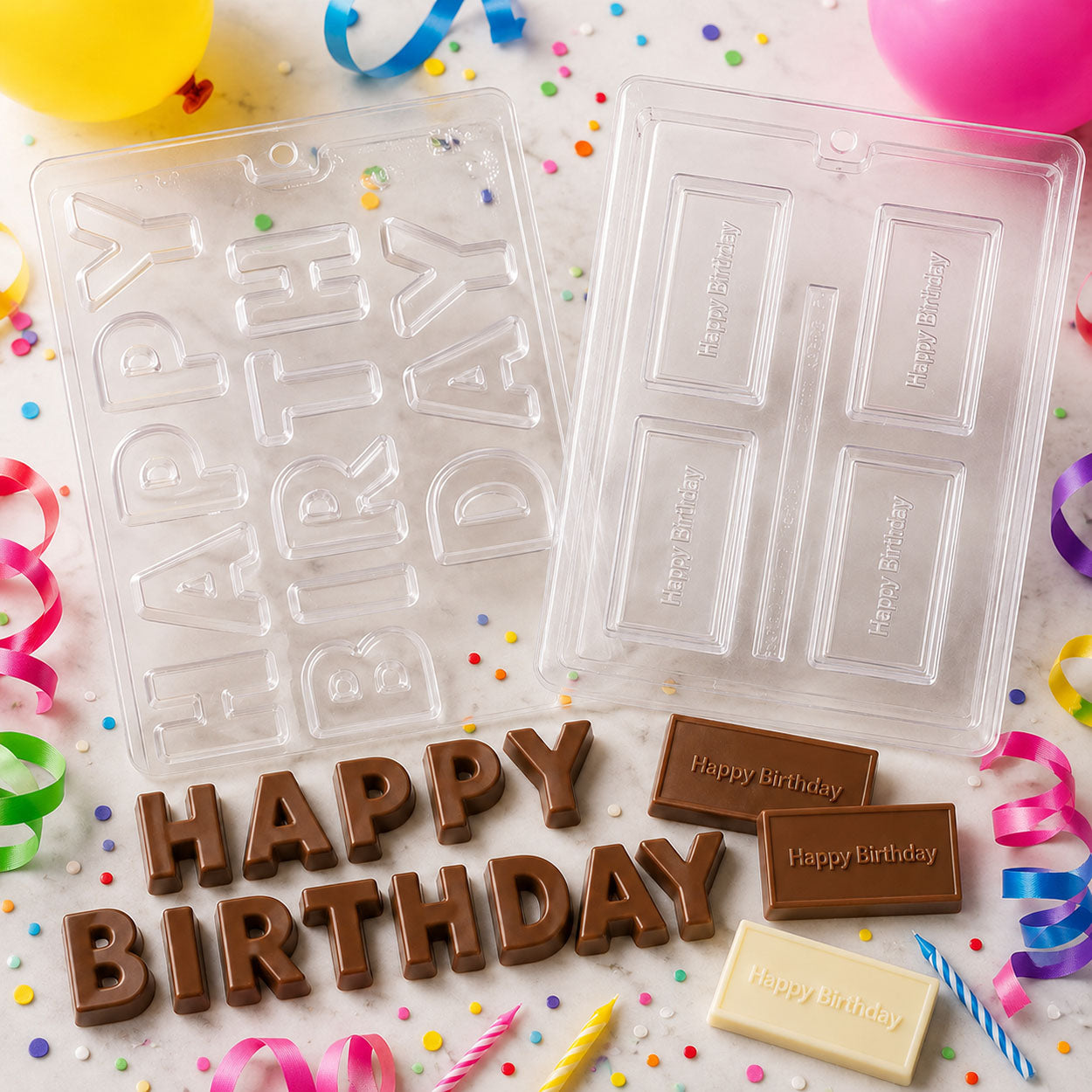 Happy Birthday chocolate molds with large letters and message bars, displayed with finished milk and white chocolate birthday candies.