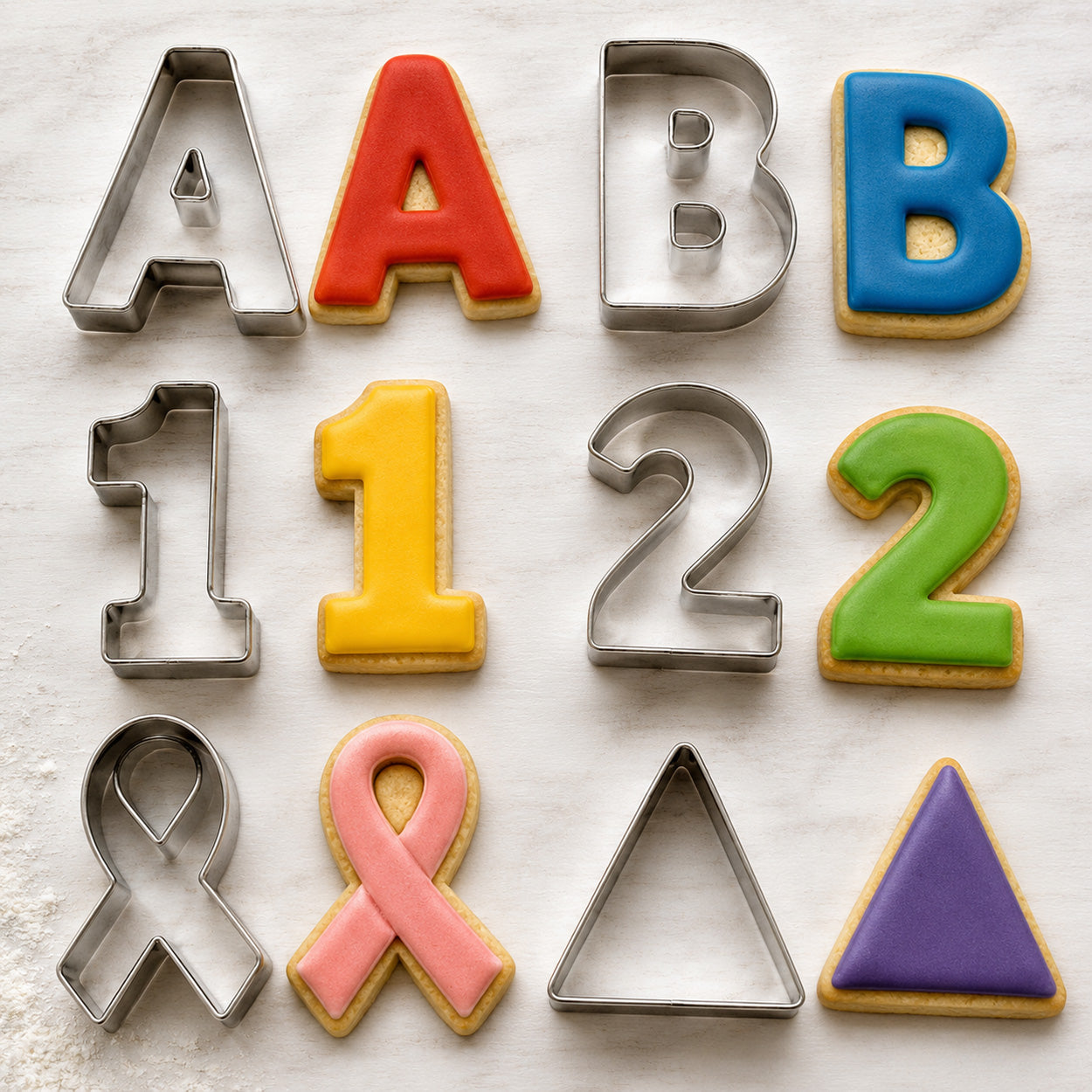 Educational cookie cutters and colorful decorated cookies shaped like letters A and B, numbers 1 and 2, an awareness ribbon, and a triangle.