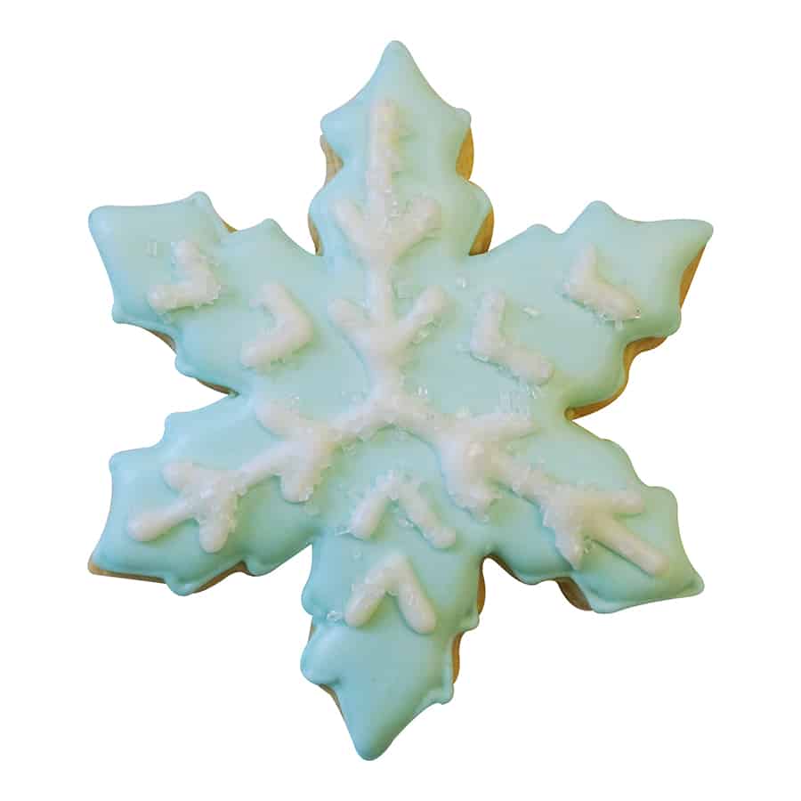 Decorated snowflake cookie with pale blue icing, white snowflake piping, and sugar crystal accents.