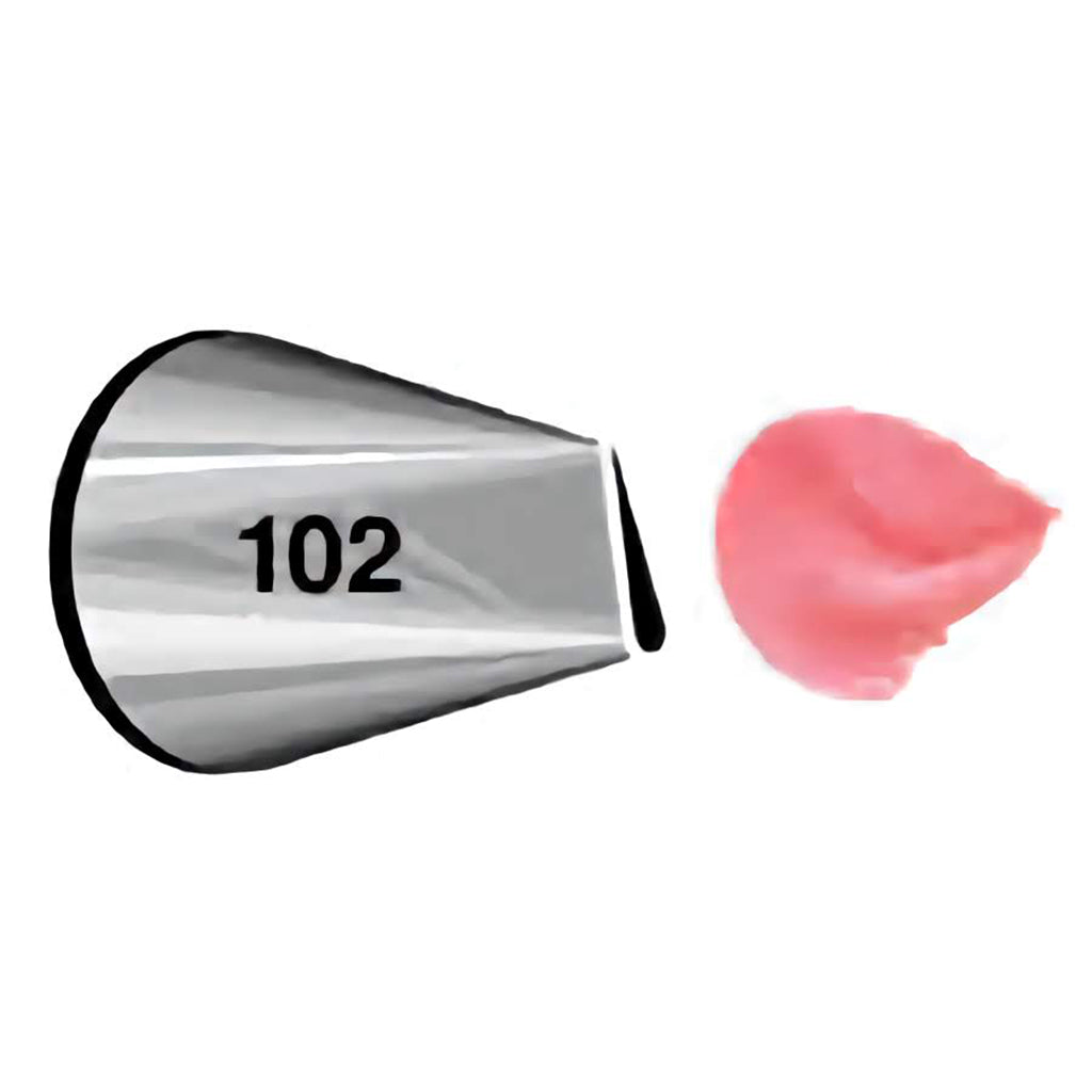 Close-up of piping tip number 102 with a petal-shaped opening, demonstrating a pink petal icing.