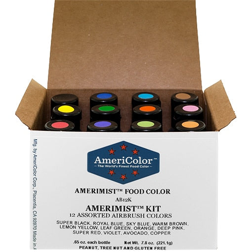 Open AmeriColor® AmeriMist™ 12 Color Airbrush Kit box holding twelve bottles with color-coded caps in black, blues, brown, yellow, green, orange, pink, red, violet, avocado, and copper.