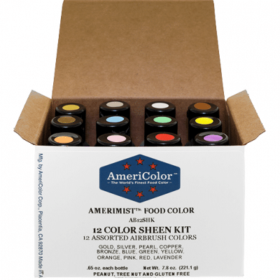 Open AmeriColor® AmeriMist™ 12 Color Sheen Airbrush Kit box showing twelve bottles with color-coded caps in metallic-inspired shades including gold, silver, pearl, copper, bronze, blue, yellow, green, orange, pink, red, and lavender.
