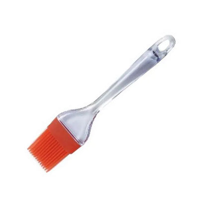 A clear-handled silicone pastry brush with red bristles, used for applying glazes or oils.