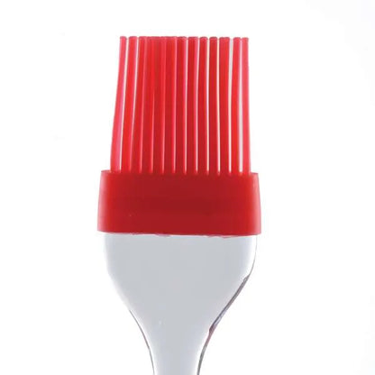 A close-up view of the red bristles of a silicone pastry brush, highlighting the flexible and fine bristles.