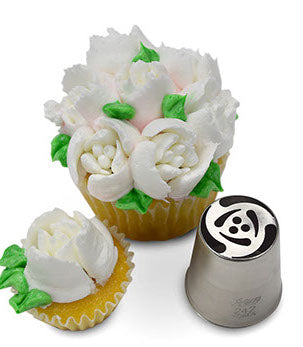 Cupcake adorned with beautifully crafted white and pink frosting roses made with Russian Piping Tip #242. The metal piping tip is shown beside the cupcake, highlighting its detailed pattern.