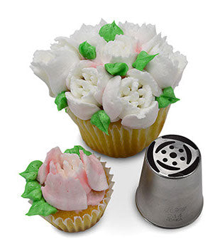 Cupcake with lovely pink and white frosting petals and green leaves, made using Russian Piping Tip #244. The corresponding metal piping tip is shown beside the cupcake, highlighting its precise pattern.