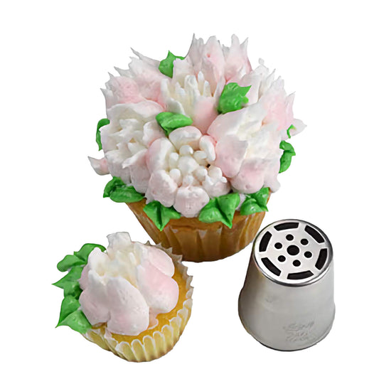 Cupcake topped with white and pink multi-petal flowers using Russian piping tip #246, displayed alongside the piping tip with a multi-hole floral design cut-out.