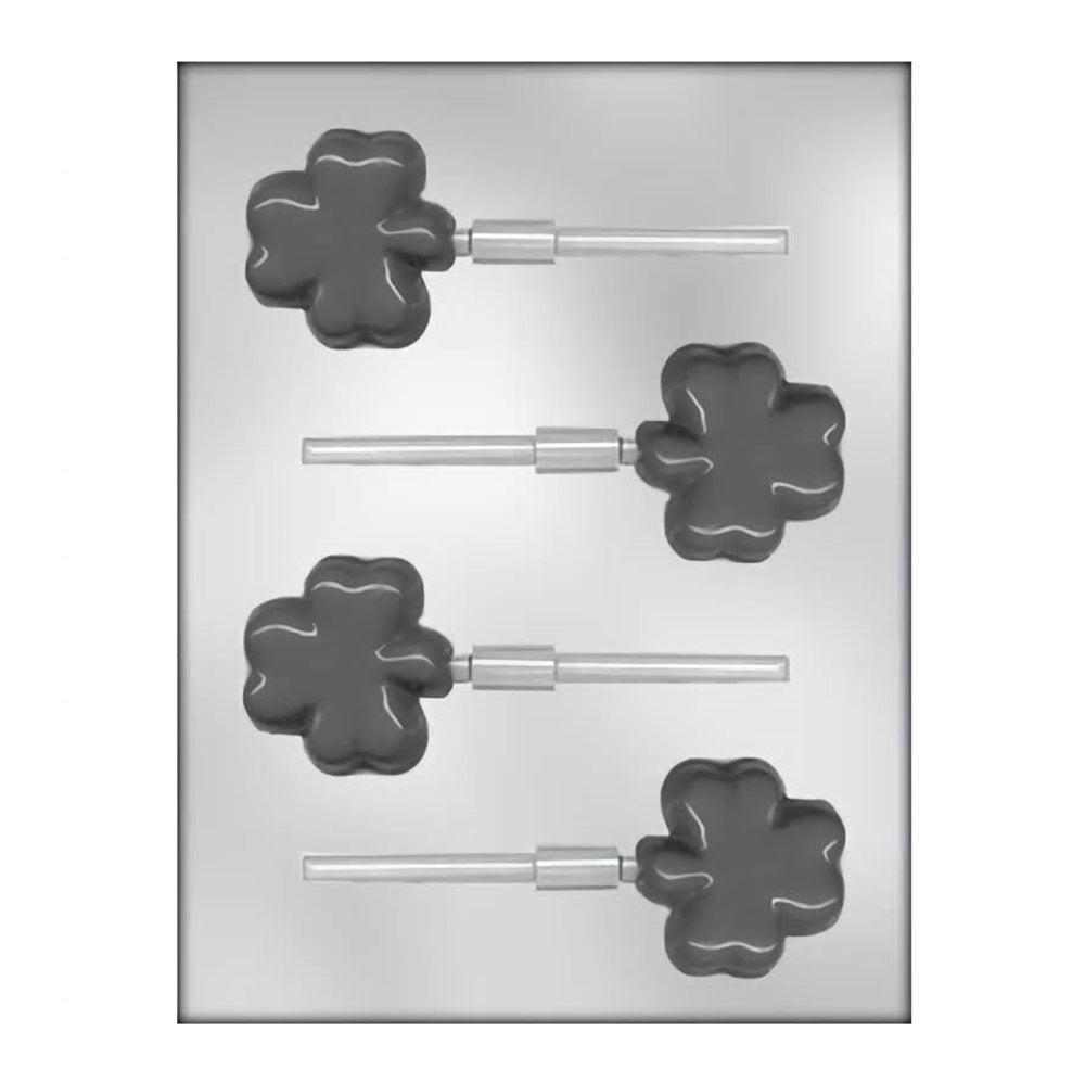 This mold provides cavities for creating shamrock-shaped chocolate lollipops, each approximately two inches in size. The shamrocks have a defined three-leaf design, with a smooth surface and space at the base for inserting lollipop sticks, ideal for themed party favors or treats.