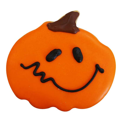 Smiling jack-o'-lantern cookie with orange frosting and a playful face design.