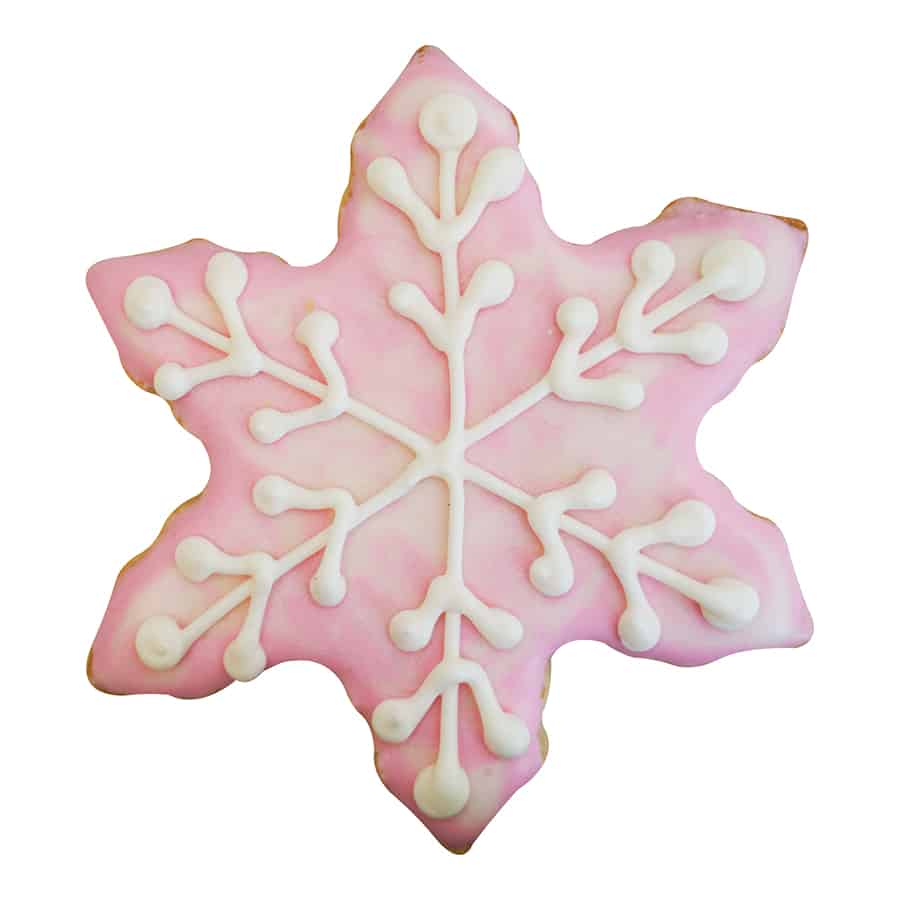 Pink frosted snowflake-shaped cookie with delicate white icing details.